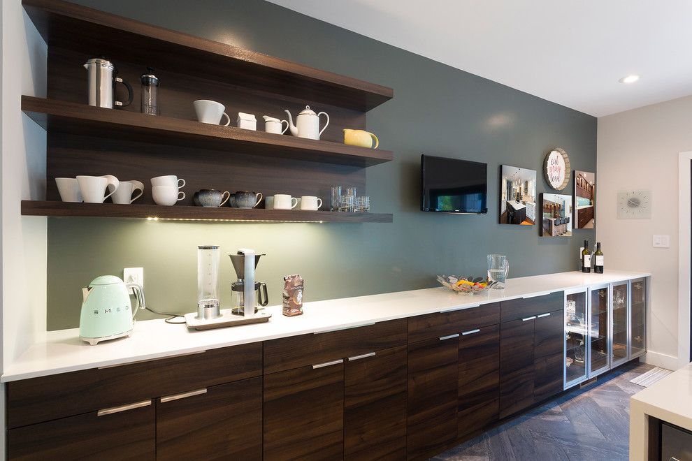 Design ideas for an expansive midcentury single-wall eat-in kitchen in Other with an undermount sink, flat-panel cabinets, dark wood cabinets, solid surface benchtops, white splashback, stone slab splashback, stainless steel appliances, ceramic floors, with island and grey floor.