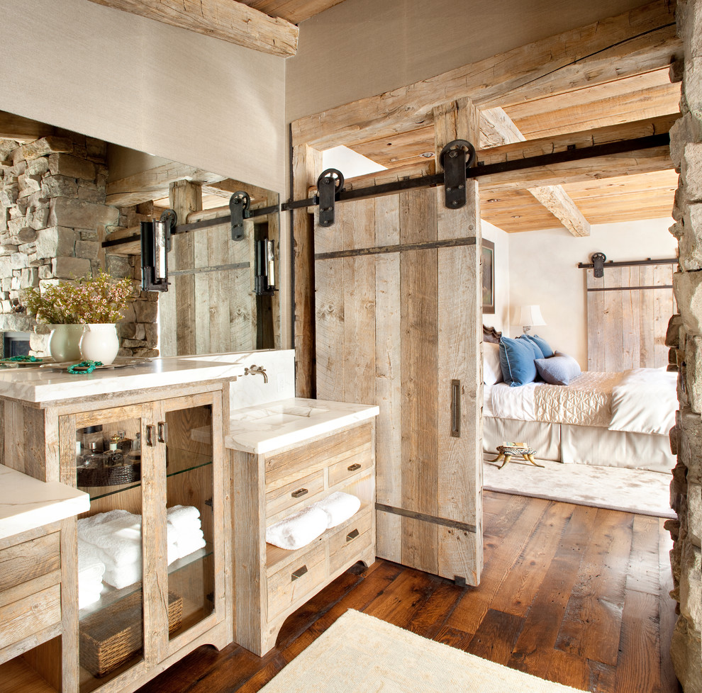 Inspiration for a mid-sized country master bathroom in Other with an undermount sink, grey walls, dark hardwood floors, flat-panel cabinets, light wood cabinets, marble benchtops, brown floor and white benchtops.