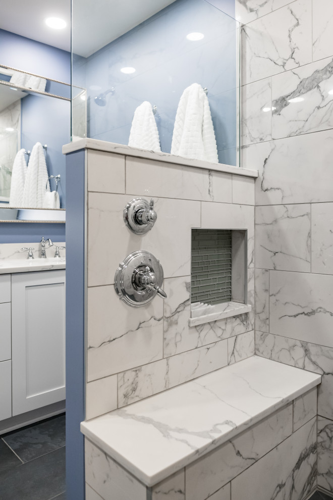 Photo of a large traditional master wet room bathroom in Columbus with white cabinets, blue walls, grey floor, an open shower, a double vanity and a built-in vanity.