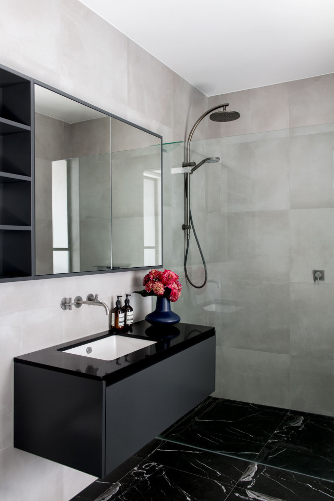 Mid-sized traditional master bathroom in Brisbane with grey cabinets, an open shower, gray tile, porcelain tile, grey walls, marble floors, solid surface benchtops, black floor, an open shower, black benchtops, a single vanity and a floating vanity.