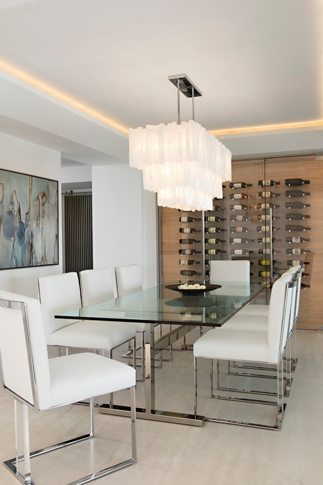 Photo of a contemporary dining room in Orange County with white walls, no fireplace and beige floor.