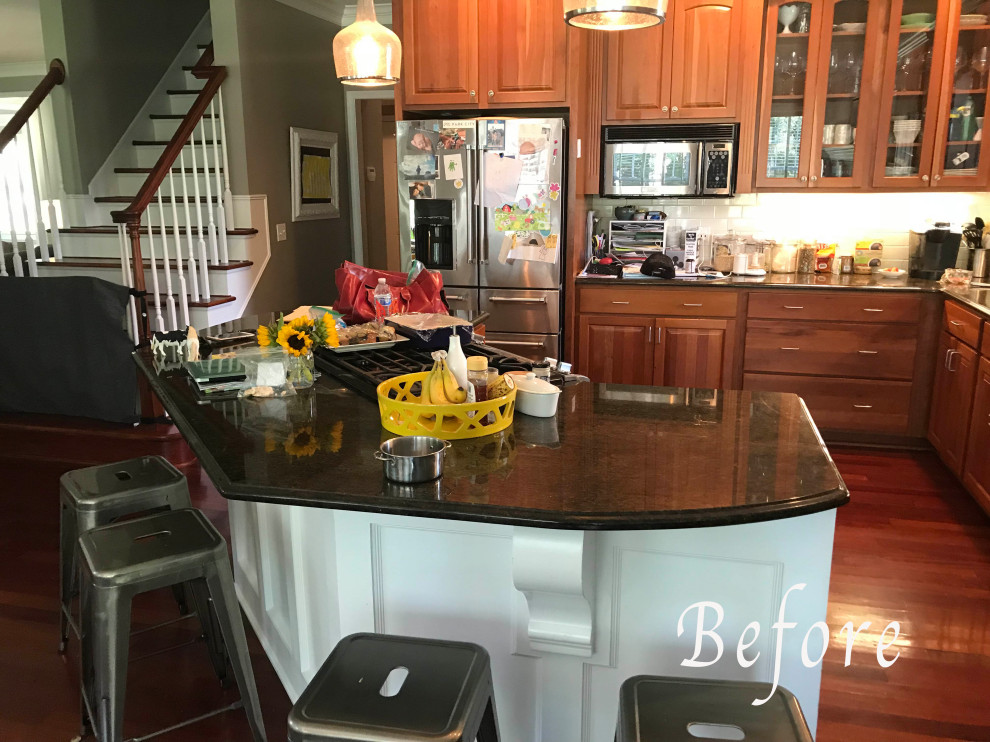 Example of a transitional kitchen design with an island