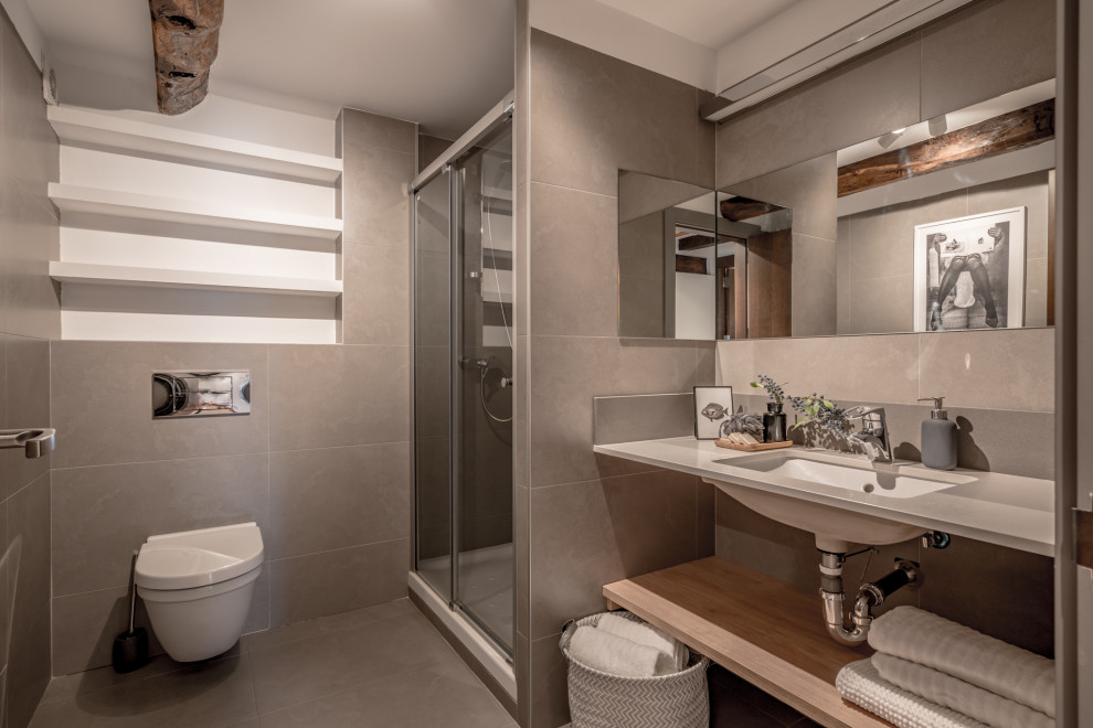 Inspiration for a large contemporary bathroom in Other with open cabinets, an alcove shower, a wall-mount toilet, gray tile, porcelain tile, an undermount sink, grey floor, a sliding shower screen, grey benchtops, a single vanity and a floating vanity.