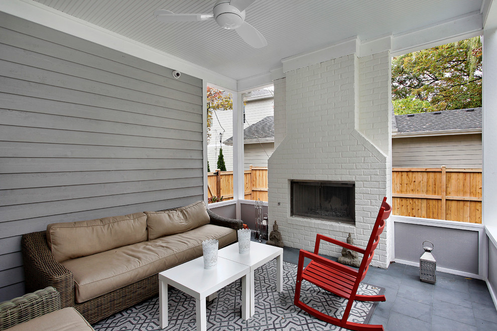 Photo of a transitional verandah in Chicago with a fire feature and a roof extension.
