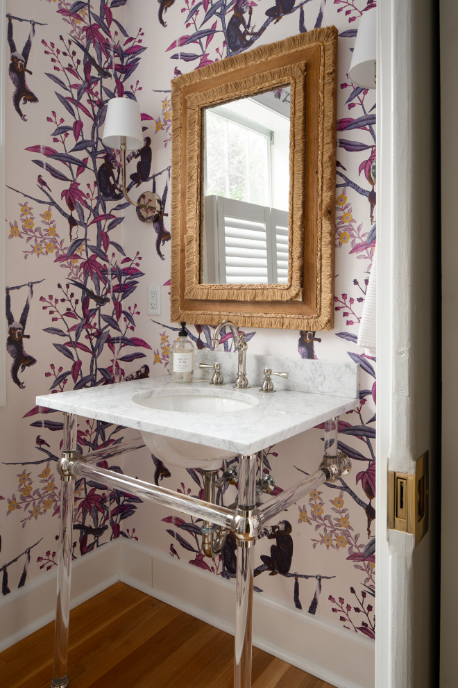 Historic Homeland Full Home Remodel - Transitional medium tone wood floor, brown floor and wallpaper powder room photo in Baltimore with multicolored walls, an undermount sink and white countertops