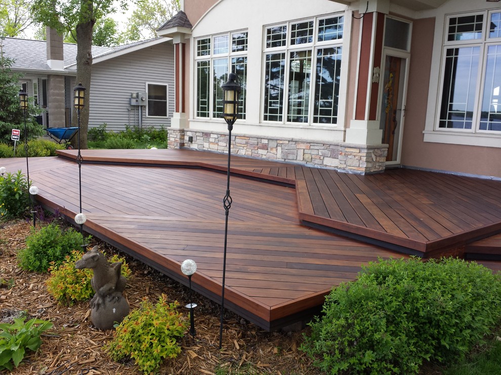 Inspiration for a large transitional backyard deck remodel in Minneapolis with no cover