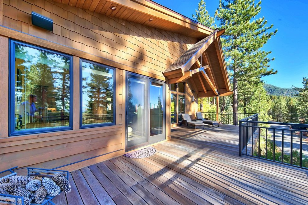 Inspiration for a large transitional backyard deck remodel with no cover