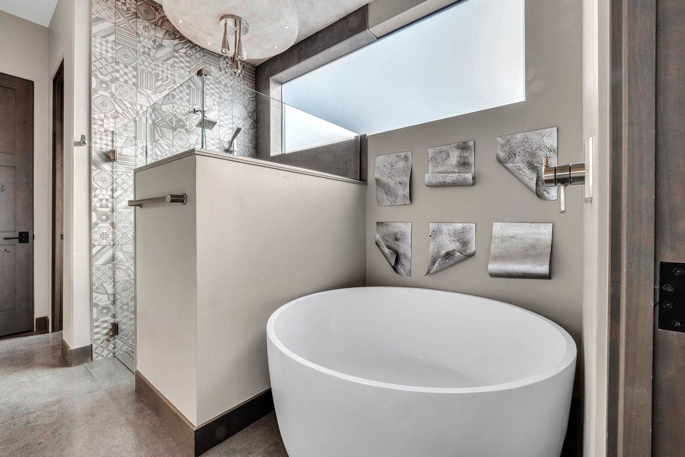 Small modern master bathroom in Denver with raised-panel cabinets, white cabinets, a freestanding tub, a curbless shower, multi-coloured tile, ceramic tile, porcelain floors, an undermount sink, quartzite benchtops, grey floor, a hinged shower door and white benchtops.