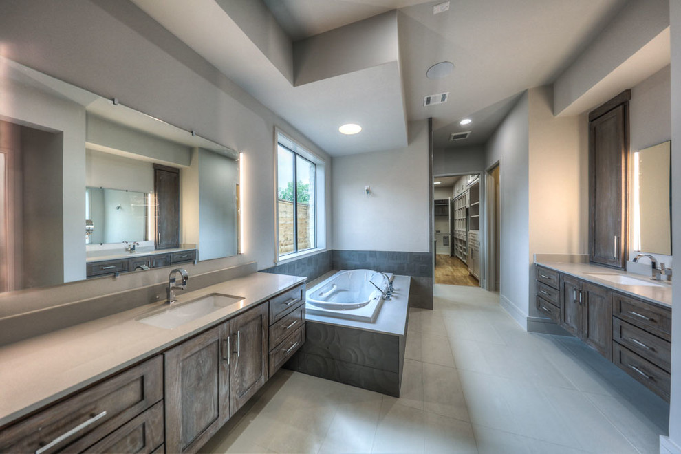 This is an example of a large contemporary master bathroom in San Francisco with shaker cabinets, distressed cabinets, a drop-in tub, engineered quartz benchtops, a double shower, grey walls, porcelain floors and an undermount sink.
