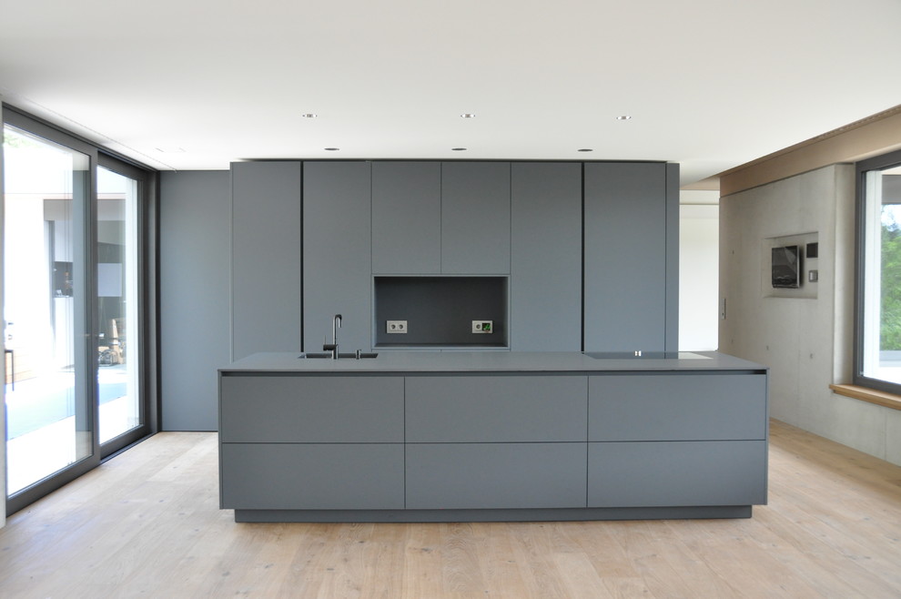 Photo of a large modern galley open plan kitchen in Frankfurt.