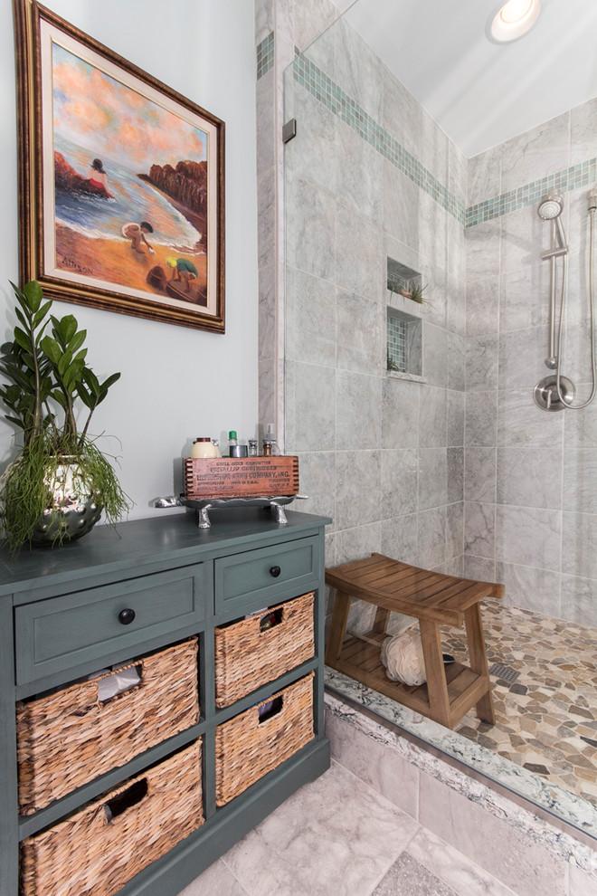 Mid-sized transitional master gray tile and porcelain tile porcelain tile and gray floor alcove shower photo in DC Metro with recessed-panel cabinets, dark wood cabinets, a two-piece toilet, blue walls, an undermount sink, quartz countertops and a hinged shower door