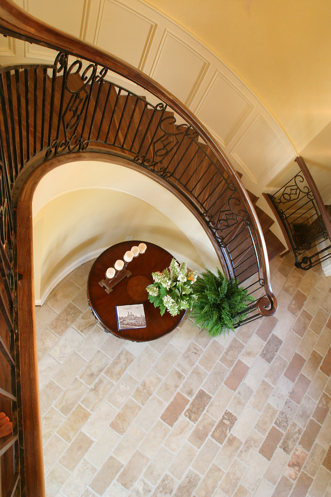 Design ideas for a mid-sized traditional wood curved staircase in Nashville with wood risers.