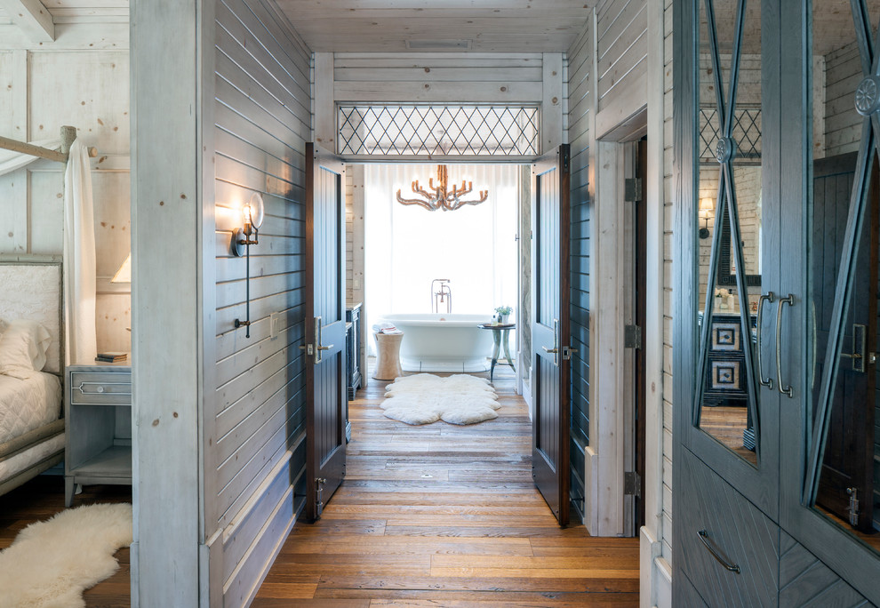 Design ideas for a country hallway in Grand Rapids with medium hardwood floors.