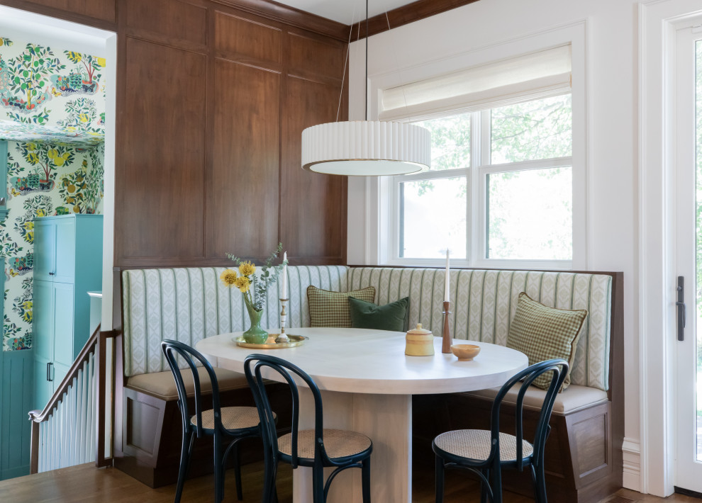 Inspiration for a transitional medium tone wood floor, brown floor and wood wall breakfast nook remodel in Chicago with brown walls