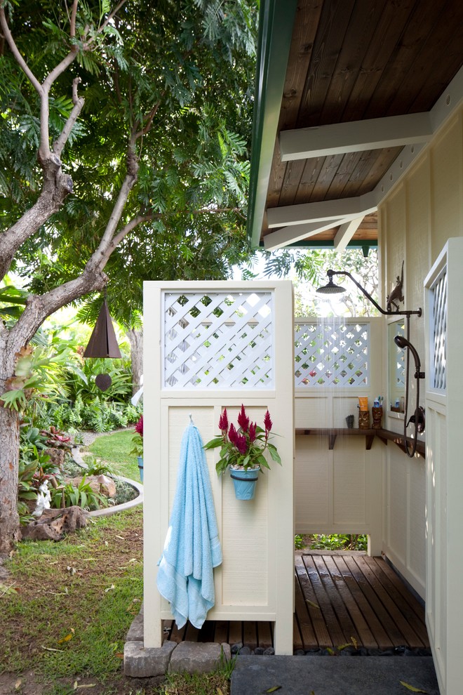 This is an example of a tropical patio in Hawaii with an outdoor shower.