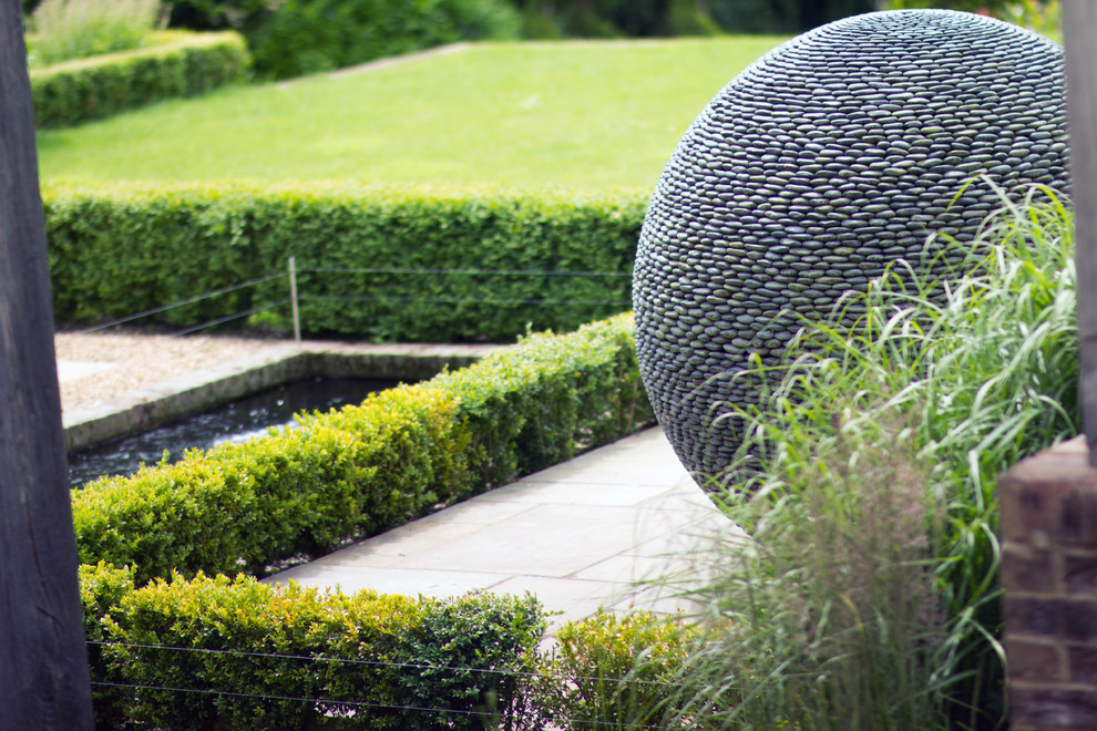 Photo of an expansive vintage front formal garden in Kent.