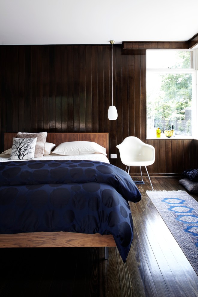 Design ideas for a mid-sized midcentury bedroom in Melbourne with dark hardwood floors and brown walls.