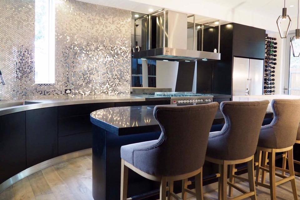 Design ideas for a large contemporary single-wall seated home bar in Adelaide with a drop-in sink, stainless steel benchtops, grey splashback, mosaic tile splashback, ceramic floors and black cabinets.