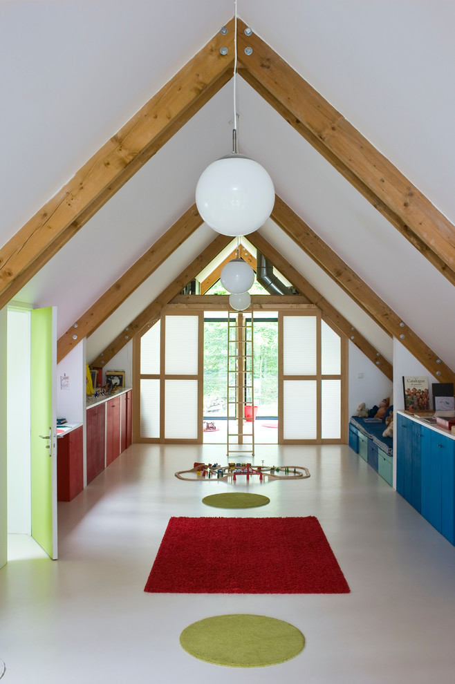 This is an example of an expansive contemporary gender-neutral kids' playroom for kids 4-10 years old in Paris.