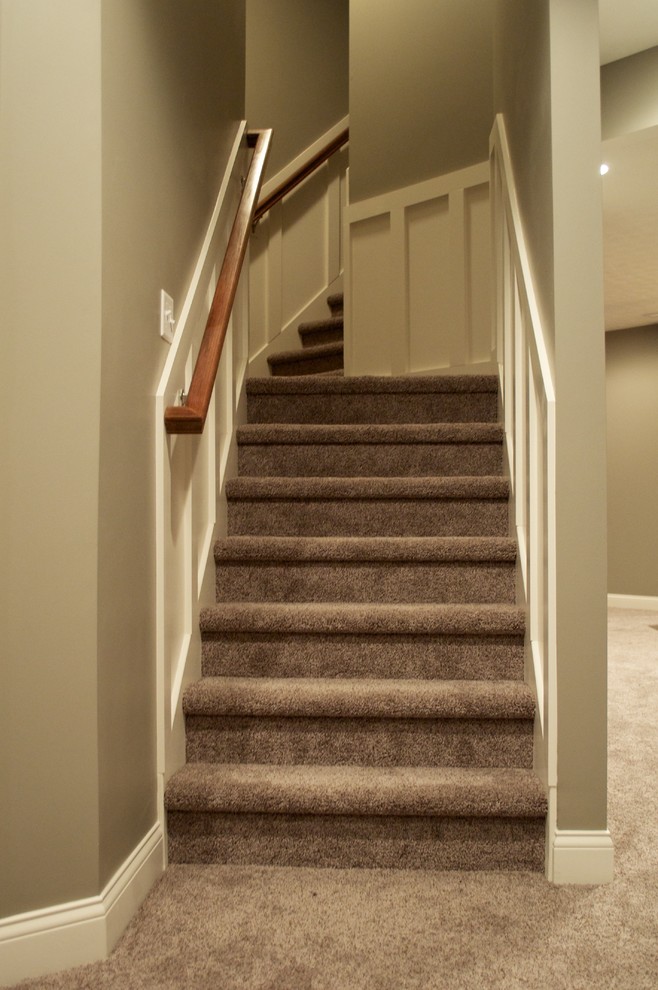 Large transitional staircase in Indianapolis.