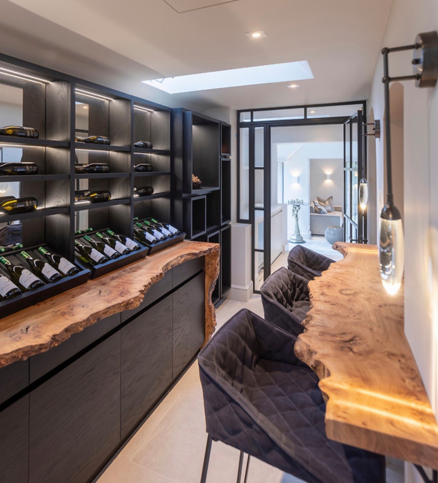 Inspiration for a large contemporary wine cellar in West Midlands with ceramic floors, display racks and white floor.