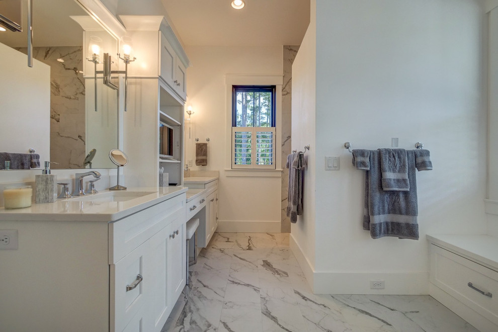 Inspiration for a mid-sized transitional master white tile and marble tile marble floor and white floor doorless shower remodel with shaker cabinets, white cabinets, a one-piece toilet, white walls, an undermount sink, quartz countertops and white countertops