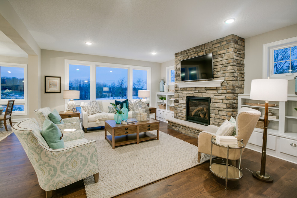 Photo of a mid-sized modern open concept family room in Minneapolis with grey walls, medium hardwood floors, a ribbon fireplace, a stone fireplace surround and a wall-mounted tv.