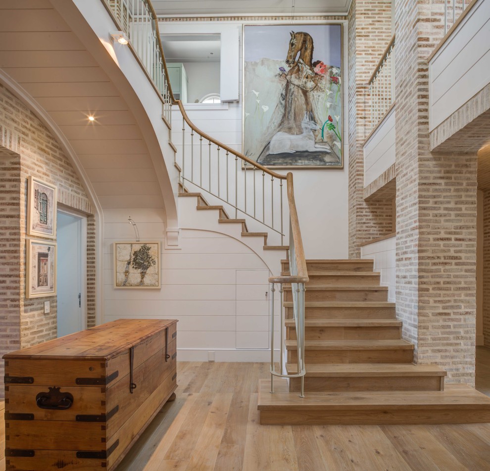 Design ideas for a beach style wood staircase in Other with wood risers.