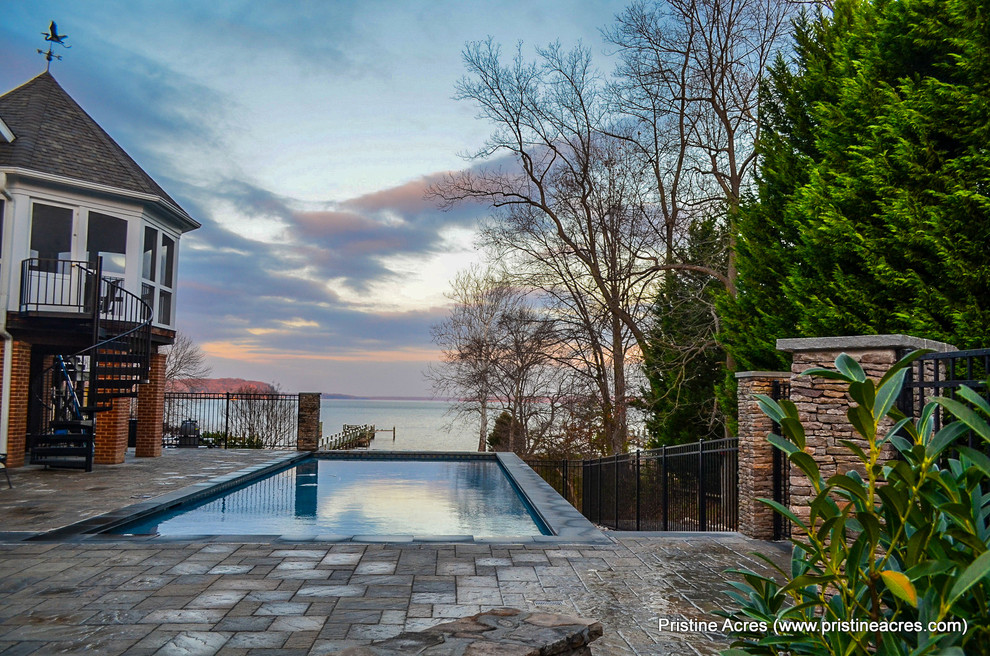 Inspiration for a mid-sized transitional side yard concrete paver and rectangular lap pool remodel in DC Metro
