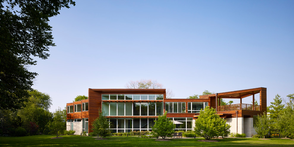 Example of a huge trendy multicolored two-story wood exterior home design in Chicago