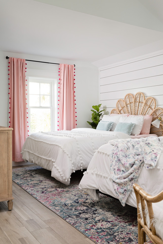 Inspiration for a large beach style kids' room for girls in Tampa with white walls, beige floor and planked wall panelling.