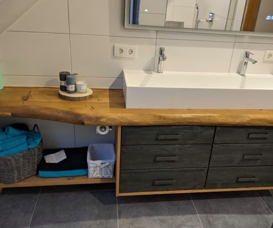 Photo of an eclectic bathroom in Hamburg with white tile, wood benchtops, brown benchtops, a double vanity and a floating vanity.
