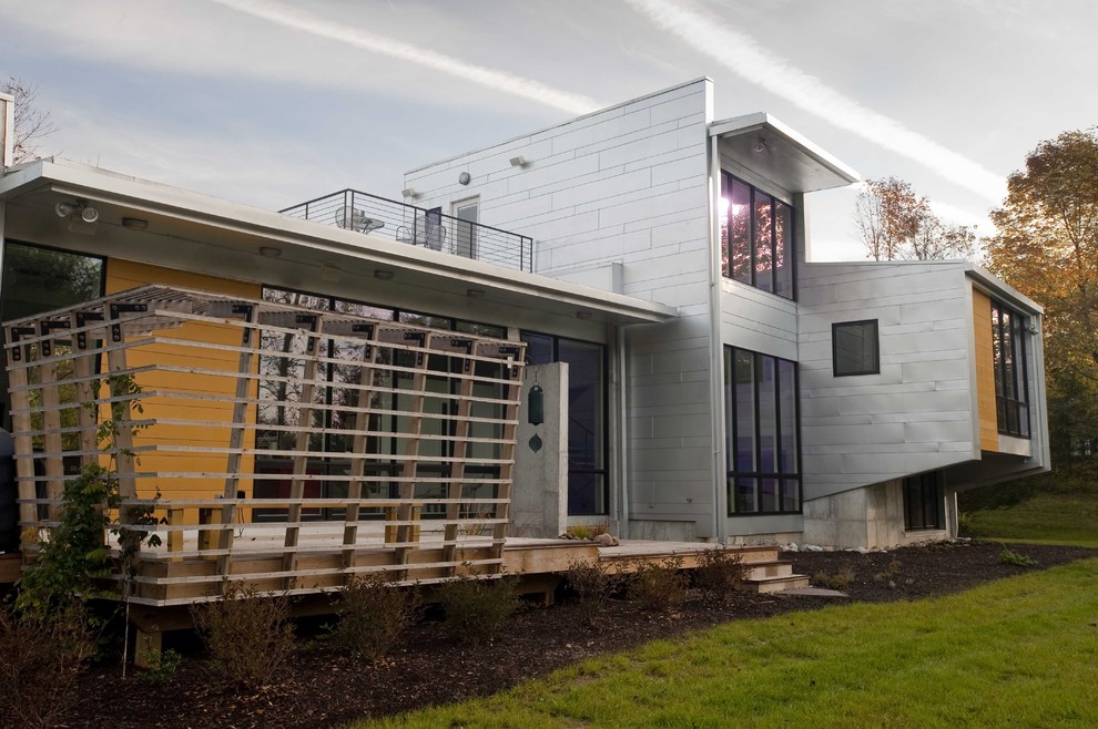 Design ideas for a contemporary two-storey exterior in Indianapolis with metal siding.
