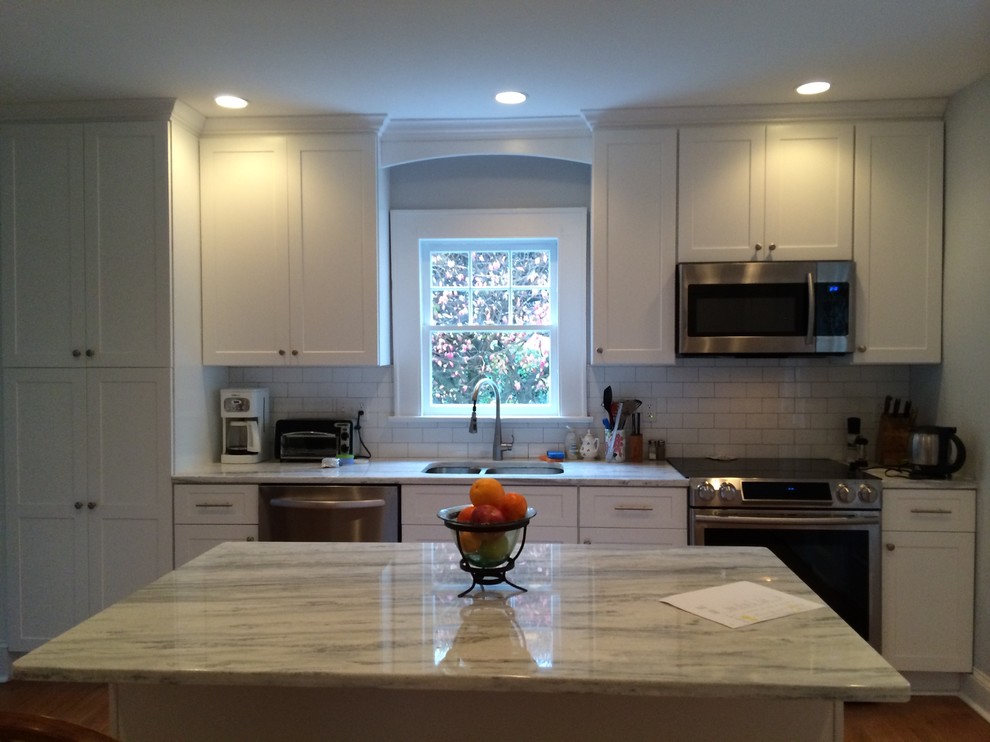 Example of a transitional kitchen design in New York