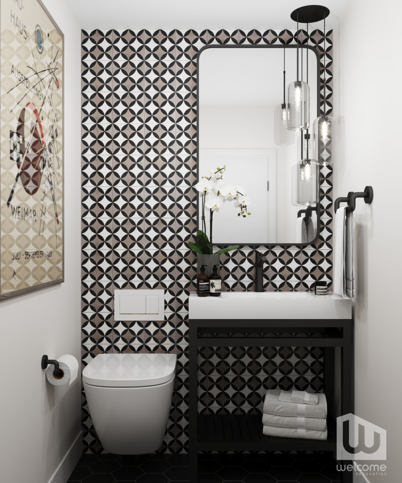 Bild på ett litet retro vit vitt toalett, med öppna hyllor, svarta skåp, en vägghängd toalettstol, svart och vit kakel, cementkakel, vita väggar, ett konsol handfat och bänkskiva i kvarts