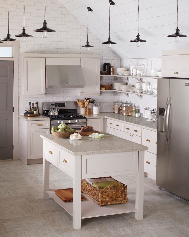 Design ideas for a mid-sized country u-shaped eat-in kitchen in New York with recessed-panel cabinets, grey cabinets, quartz benchtops, white splashback, subway tile splashback, stainless steel appliances, with island and a farmhouse sink.