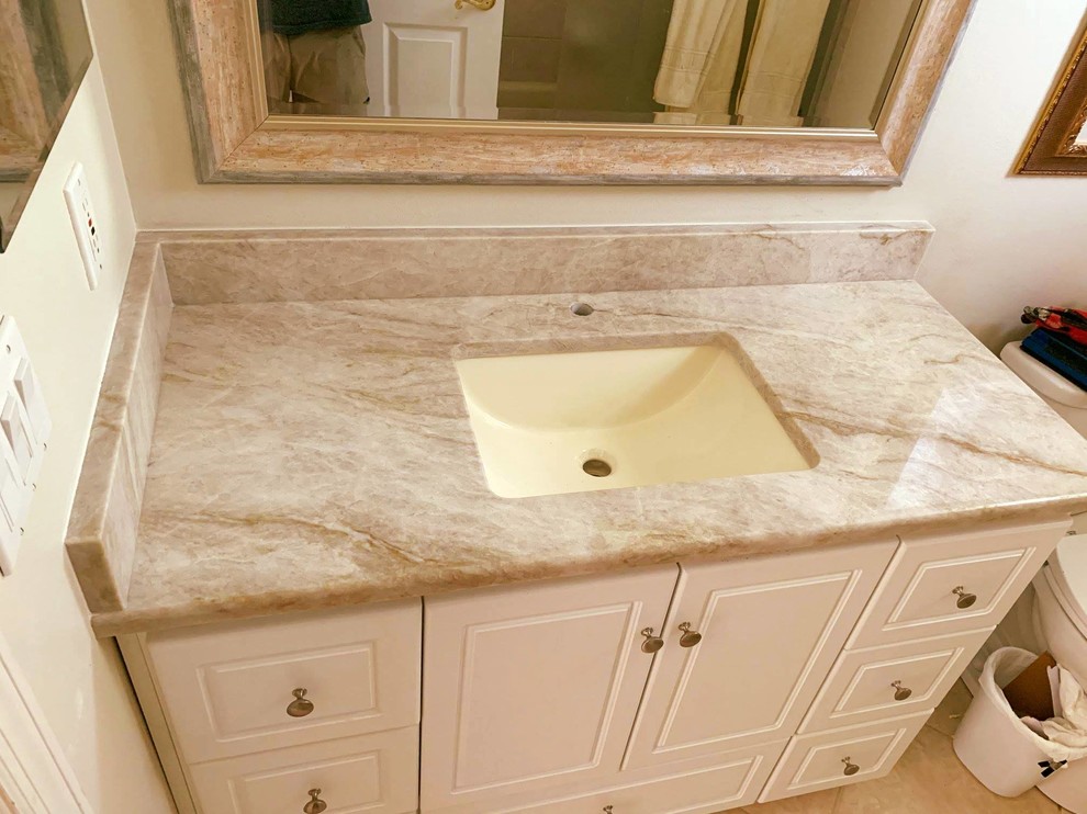 Mid-sized modern 3/4 bathroom in Tampa with an undermount sink and quartzite benchtops.