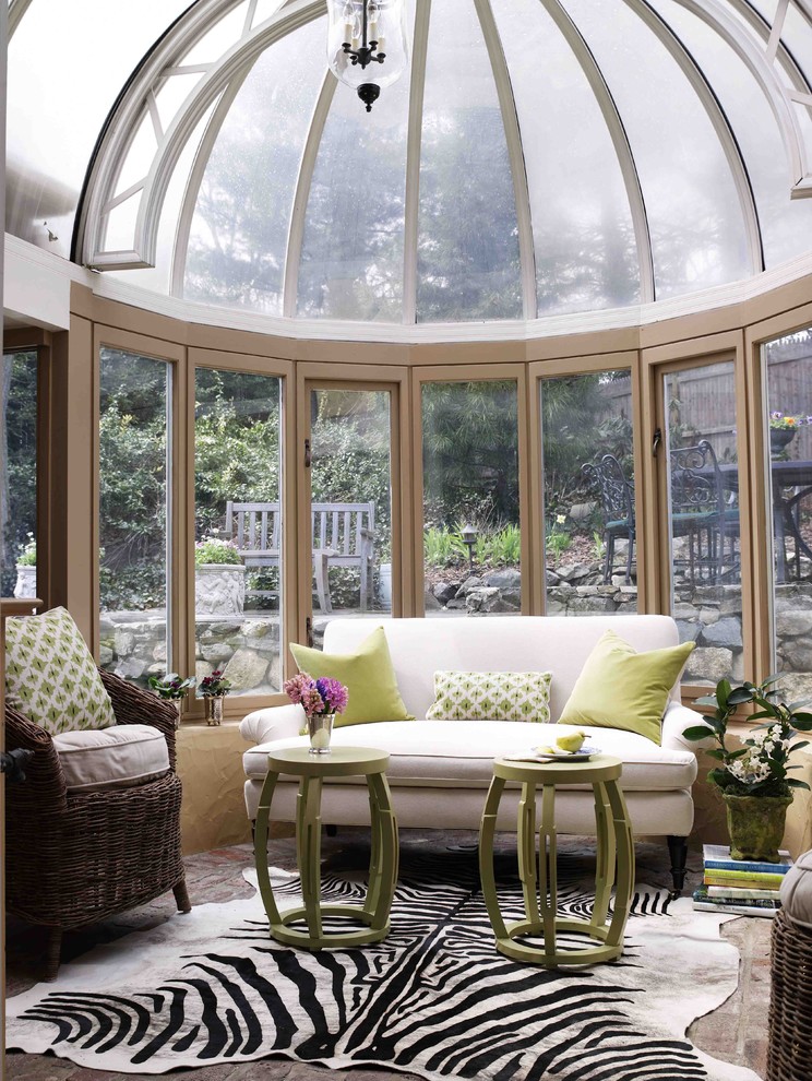 Photo of a traditional sunroom in New York with a glass ceiling.