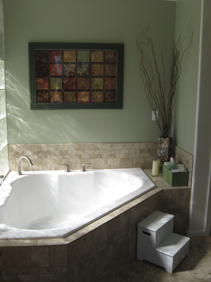 Inspiration for a mid-sized traditional master bathroom in Phoenix with a corner tub, beige tile, ceramic tile, ceramic floors and beige floor.