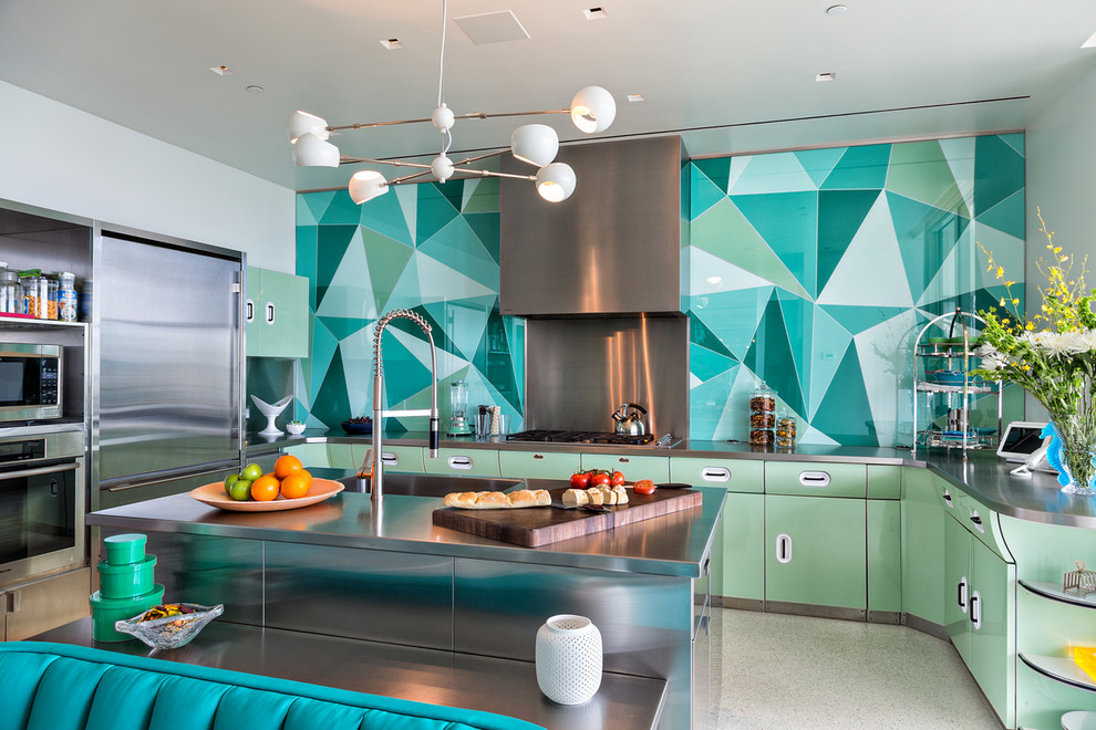 This is an example of a contemporary u-shaped kitchen in Miami with flat-panel cabinets, grey cabinets, stainless steel benchtops, multi-coloured splashback, stainless steel appliances and with island.