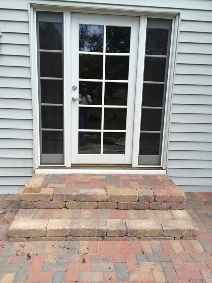 Design ideas for a small traditional backyard patio in Other with brick pavers and no cover.