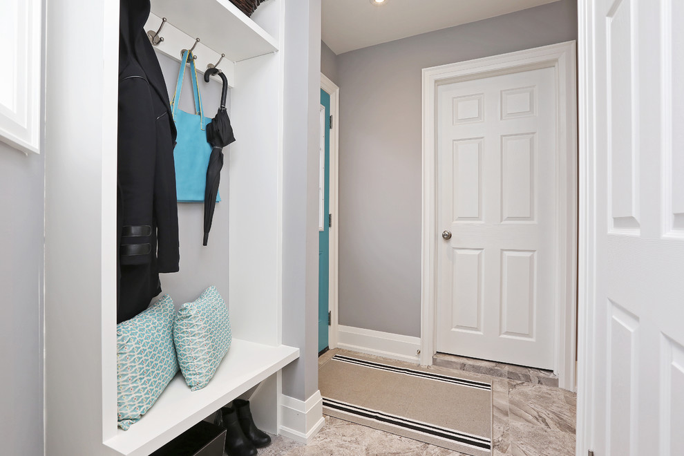 Example of a mid-sized transitional mudroom design in Toronto with gray walls and a blue front door