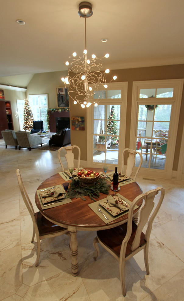 This is an example of an expansive traditional open plan dining in Atlanta with travertine floors.