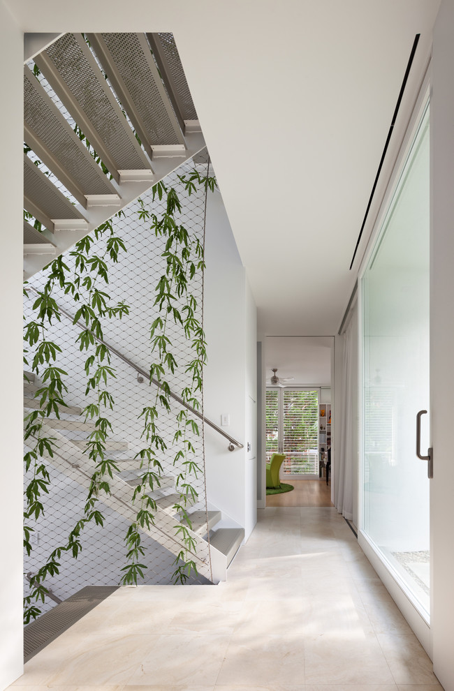 Inspiration for a contemporary hallway in DC Metro with white walls and white floor.
