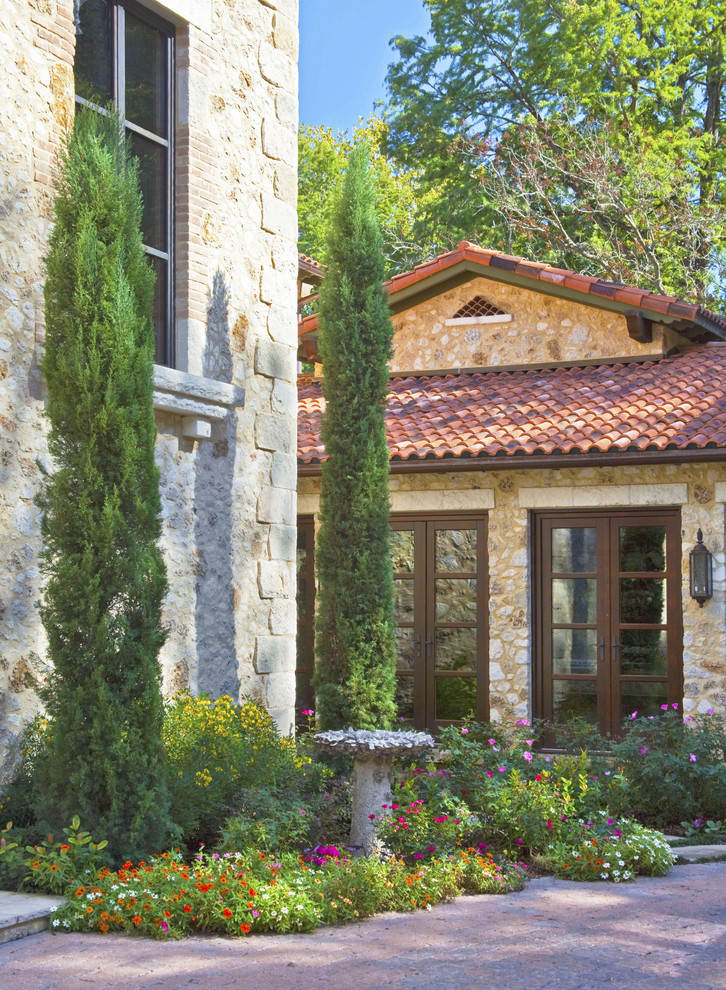 Inspiration for a large mediterranean two-storey exterior in Austin.
