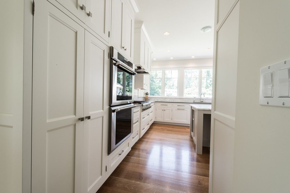 Example of a transitional kitchen design in New York