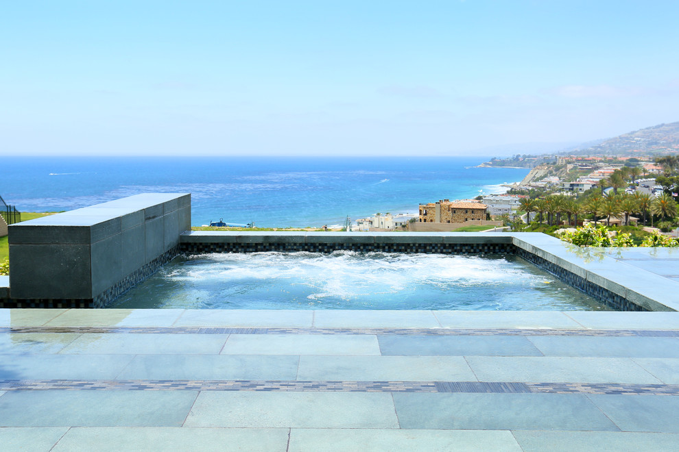 Inspiration for a backyard rectangular pool remodel in Orange County