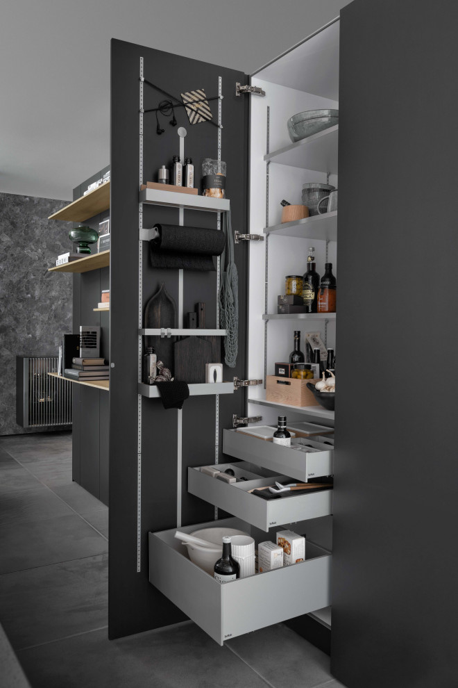 Modern kitchen pantry in Tokyo with grey cabinets and grey splashback.