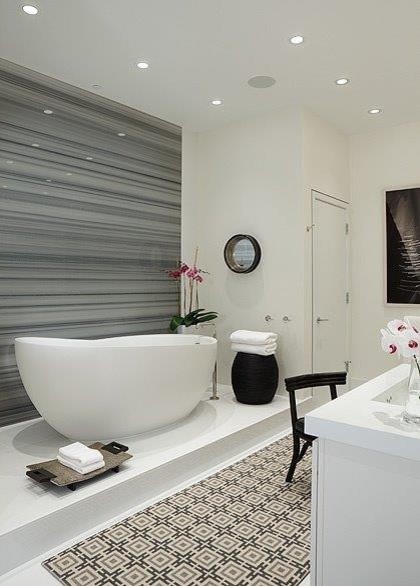 This is an example of a mid-sized contemporary master bathroom in Perth with an undermount sink, a freestanding tub, multi-coloured tile, white walls and porcelain floors.