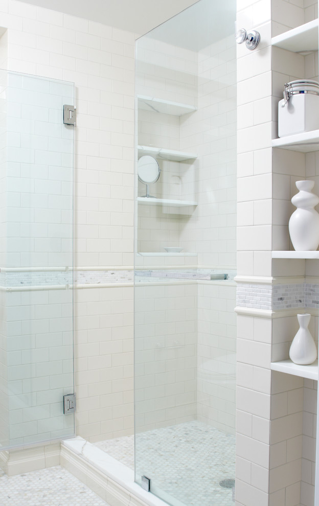 Example of a small transitional master beige tile and ceramic tile marble floor alcove shower design in New York with a pedestal sink, marble countertops, a one-piece toilet, flat-panel cabinets, white cabinets and beige walls